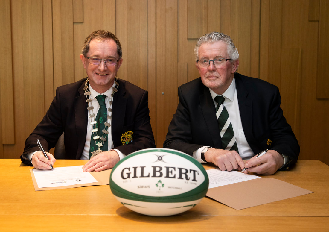 Gerry McGuinness (President of Community Games) and Robert Deacon (Chair of IRFU Youth Committee) sign an historic agreement between the two organisations